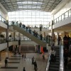 shoppers in a big shopping center with elevators